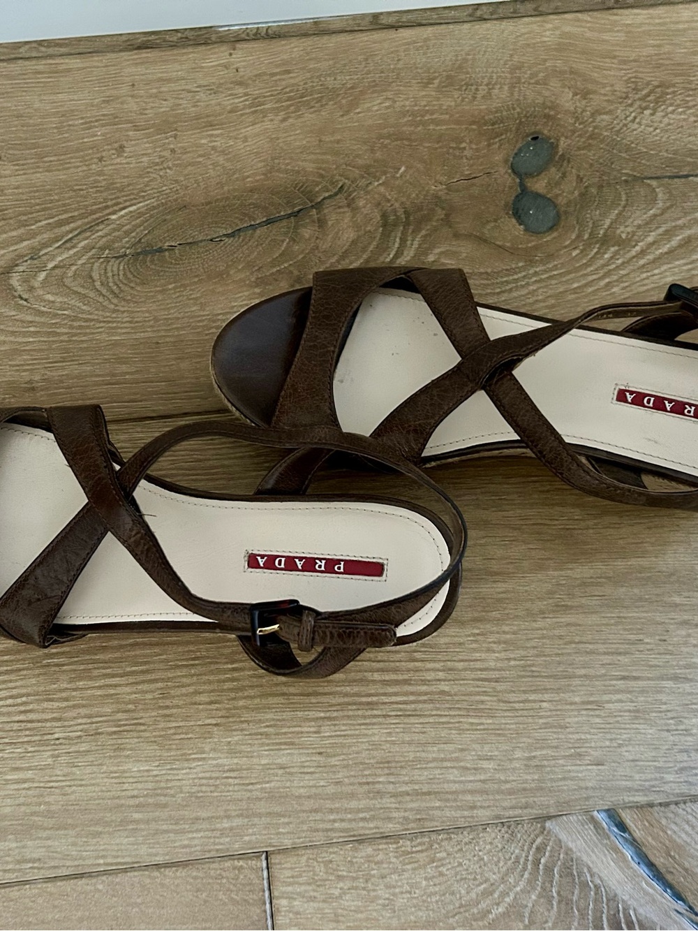 Prada caramel/chocolate brown wedge sandal w/ rope cork heel tortoise buckle.
